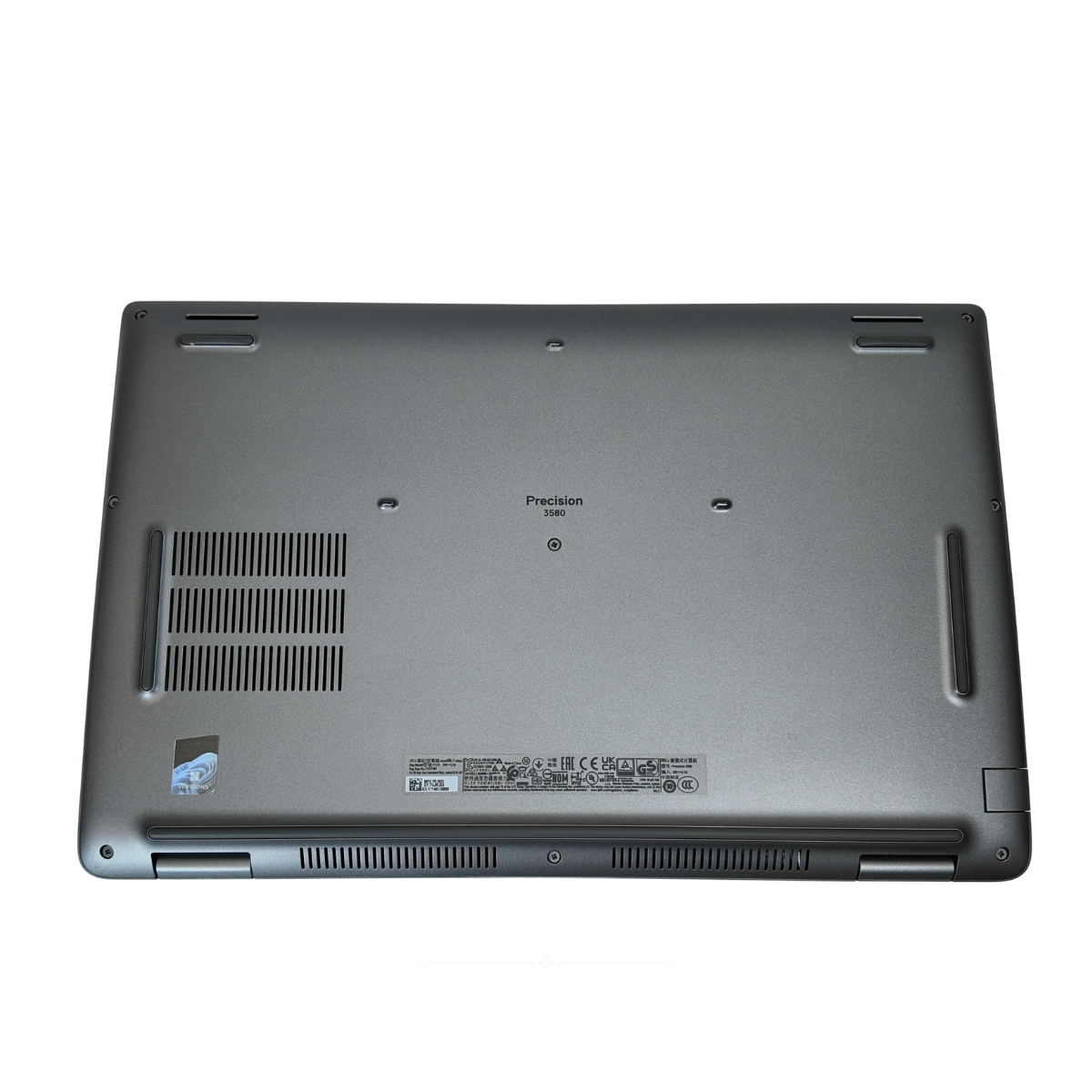 Back cover of a Titan Grey Dell Precision 3580 15.6-inch mobile workstation laptop, showing the open display, thin bezels, and full-sized backlit keyboard with numeric keypad.