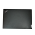 Lid of a black Lenovo ThinkPad T14s Gen 2 laptop, open to show the 14-inch screen, backlit keyboard with a red TrackPoint, and slim chassis.